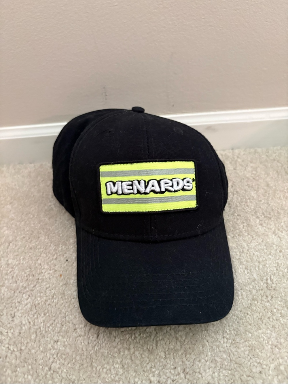 Menards Black Baseball Cap with Neon Yellow Patch